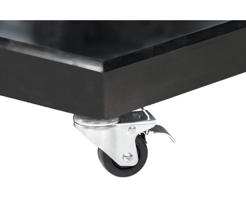 Vue détaillée d''une roulette de transport avec frein de stationnement sur un meuble.