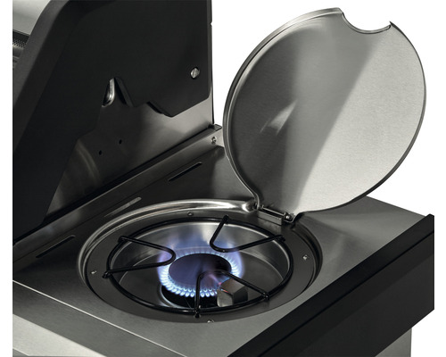 Gros plan d''un barbecue à gaz avec couvercle ouvert et plaque de cuisson allumée