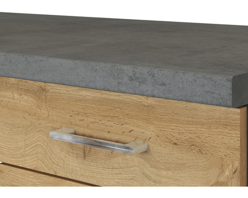 Detailaufnahme eines Möbelstücks mit Arbeitsplatte und Schublade