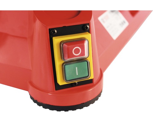 Gros plan sur le boîtier de commande jaune avec les boutons marche/arrêt rouge et vert