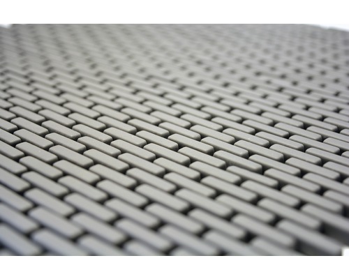 Gros plan d''un tapis en caoutchouc gris avec un motif rectangulaire.