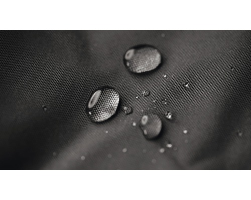 Gros plan de gouttes d''eau sur un tissu hydrofuge