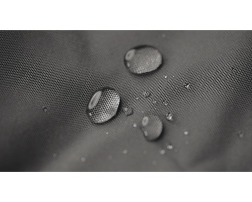 Gros plan de gouttes d''eau sur un tissu hydrofuge