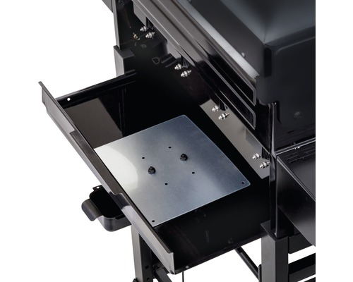 Vue détaillée d''un gril à gaz noir avec tiroir ouvert et plaque métallique