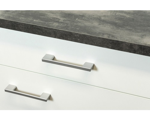 Detailansicht eines Badezimmerschranks mit zwei Schubladen, Arbeitsplatte und Griffen