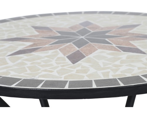 Gros plan d''une table en mosaïque avec motif étoilé