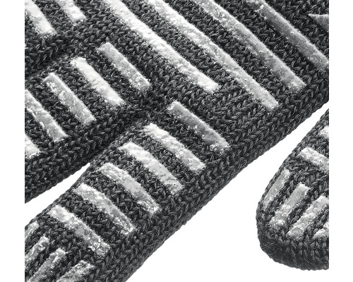 Gros plan d''un gant de travail avec des bandes antidérapantes