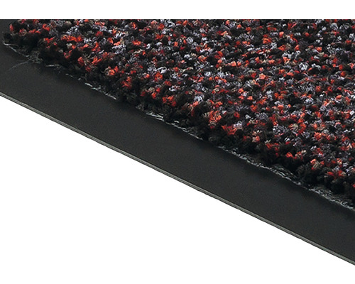 Gros plan d''un tapis de sol avec surface textile multicolore et bordure en caoutchouc