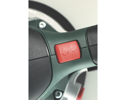 Vue détaillée d''un outil avec un interrupteur rouge pour la fonction de rotation