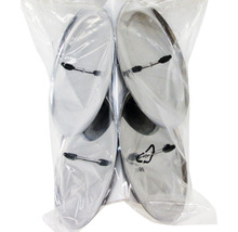 Quatre patins pour meubles en métal avec fixation dans un emballage plastique