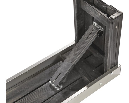 Vue détaillée d''un potager surélevé avec bois et bordure métallique