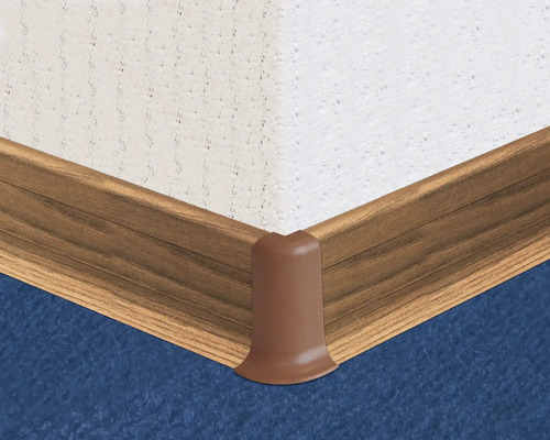 Sockelleisten Ecke aus Kunststoff an einer Wand