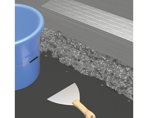 Représentation d''une rénovation de sol avec enduit de lissage, seau et spatule