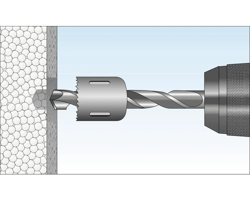 Perceuse avec scie cloche perçant un trou dans un mur.