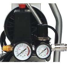 Vue détaillée d''un compresseur avec manomètres et régulateurs