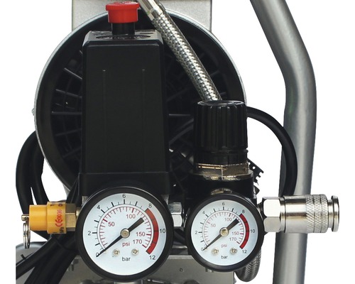 Vue détaillée d''un compresseur avec manomètres et régulateurs