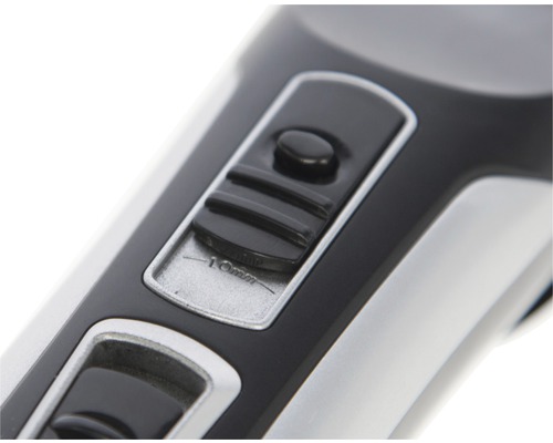 Gros plan d''une tondeuse à cheveux avec interrupteur pour le réglage de la longueur jusqu''à dix millimètres.