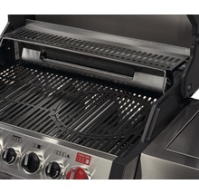 Vue intérieure d''un barbecue à gaz avec grille et réchaud
