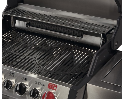 Vue intérieure d''un barbecue à gaz avec grille et réchaud