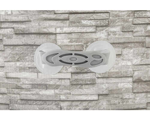 Grauer Fliesenheber mit Saugnäpfen an einer Wand