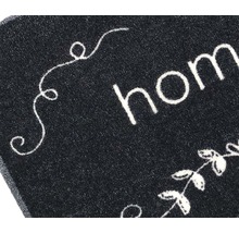 "Detailansicht einer Fußmatte mit dem Schriftzug ""Home""."