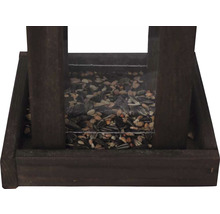 Mangeoire en bois avec nourriture pour oiseaux