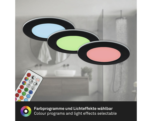 Trois plafonniers ronds avec différentes couleurs de lumière et une télécommande dans une salle de bains.