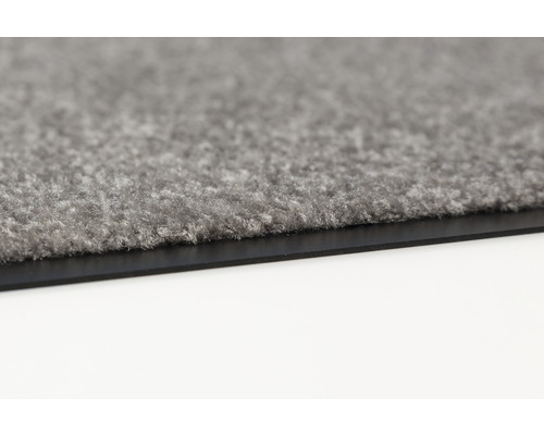 Vue détaillée d''un paillasson gris avec bordure en caoutchouc