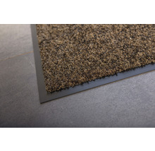 Vue détaillée d''un tapis de propreté marron avec une bordure noire.