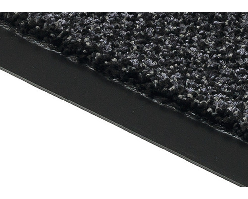 Gros plan d''un paillasson avec surface textile et bordure en caoutchouc