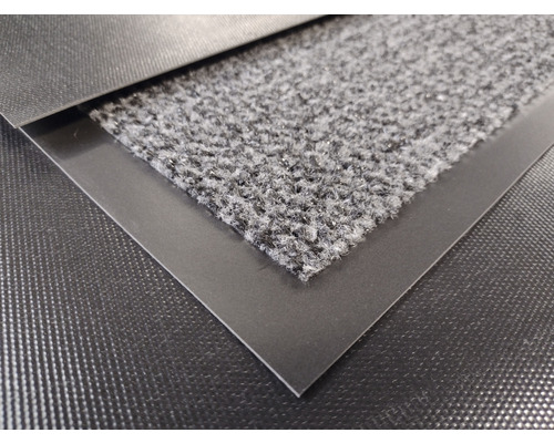 Detailansicht einer Fußmatte mit textilem Obermaterial und umlaufendem Rand