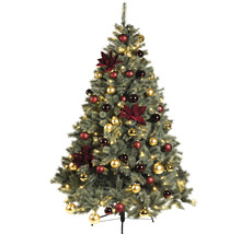 Arbre de Noël décoré avec des boules rouges et dorées ainsi que des fleurs