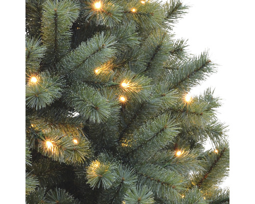 Gros plan sur un sapin de Noël artificiel avec éclairage
