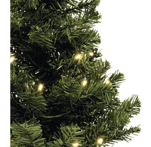 Gros plan sur un arbre de Noël artificiel vert avec éclairage