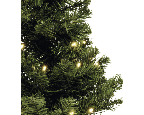 Gros plan sur un arbre de Noël artificiel vert avec éclairage