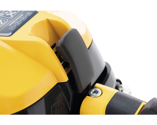 Detailansicht eines gelben Motorgehäuses mit schwarzem Hebel