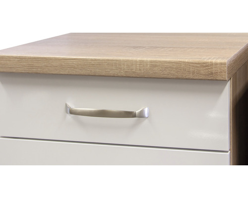 Detailaufnahme eines Schranks mit Schubladen und Griff
