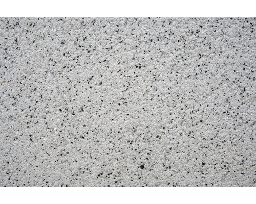 Gros plan d'une surface d'enduit avec une structure de gravier