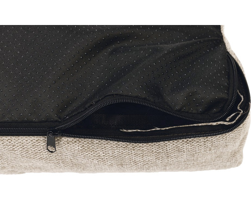 Détail d''un lit pour chien avec fermeture éclair et fond antidérapant