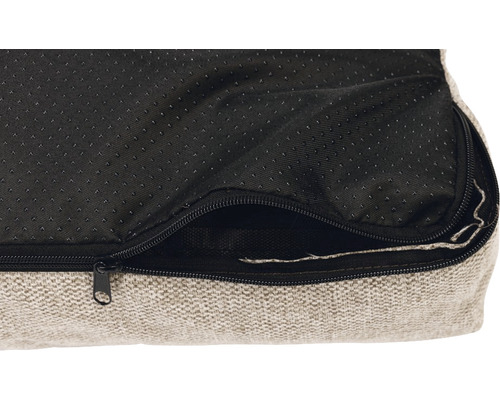 Vue détaillée d''un lit pour chien avec fermeture éclair et fond antidérapant.