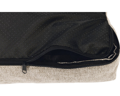 Gros plan sur un lit pour chien avec fermeture éclair et dessous antidérapant