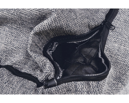 Gros plan d''un sac en tissu gris avec fermeture éclair