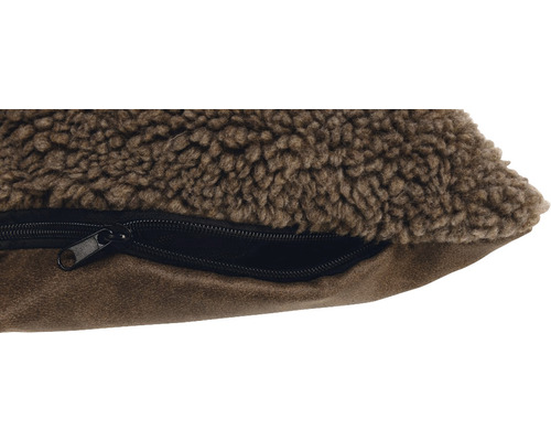 Detailansicht eines Hundebetts mit Reißverschluss und Teddyplüschbezug.