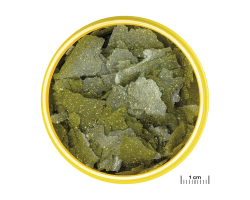 Fischfutterflocken in einer Dose