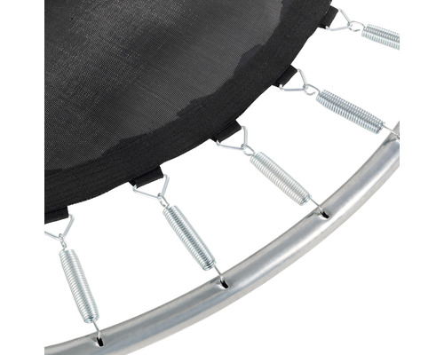 Gros plan d''un trampoline avec ressorts, toile de saut et cadre