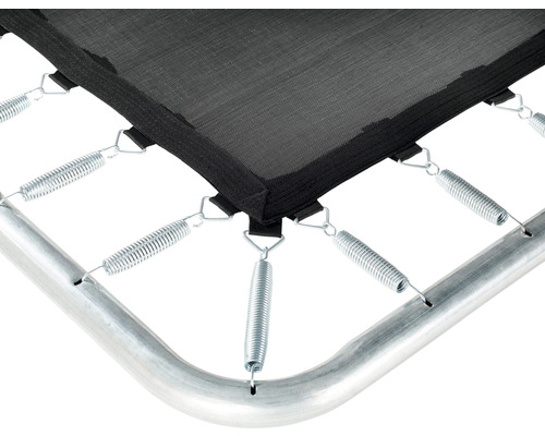 Gros plan d''un trampoline avec toile de saut, ressorts et cadre