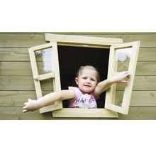 Fille regardant par la fenêtre d''une cabane