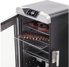 Fumoir électrique avec des côtes levées sur des grilles