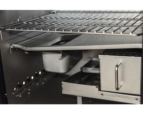 Vue intérieure d''un barbecue avec grille, bac de récupération des graisses et fumoir