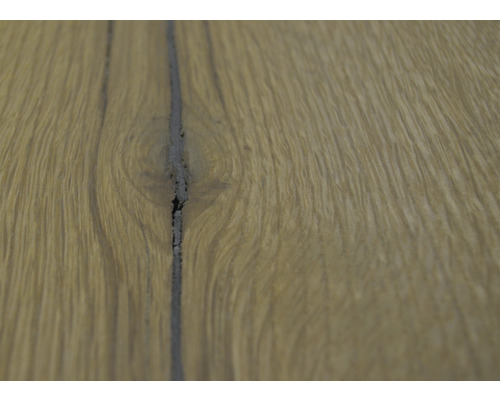 Gros plan d''un plancher en bois avec un joint sombre